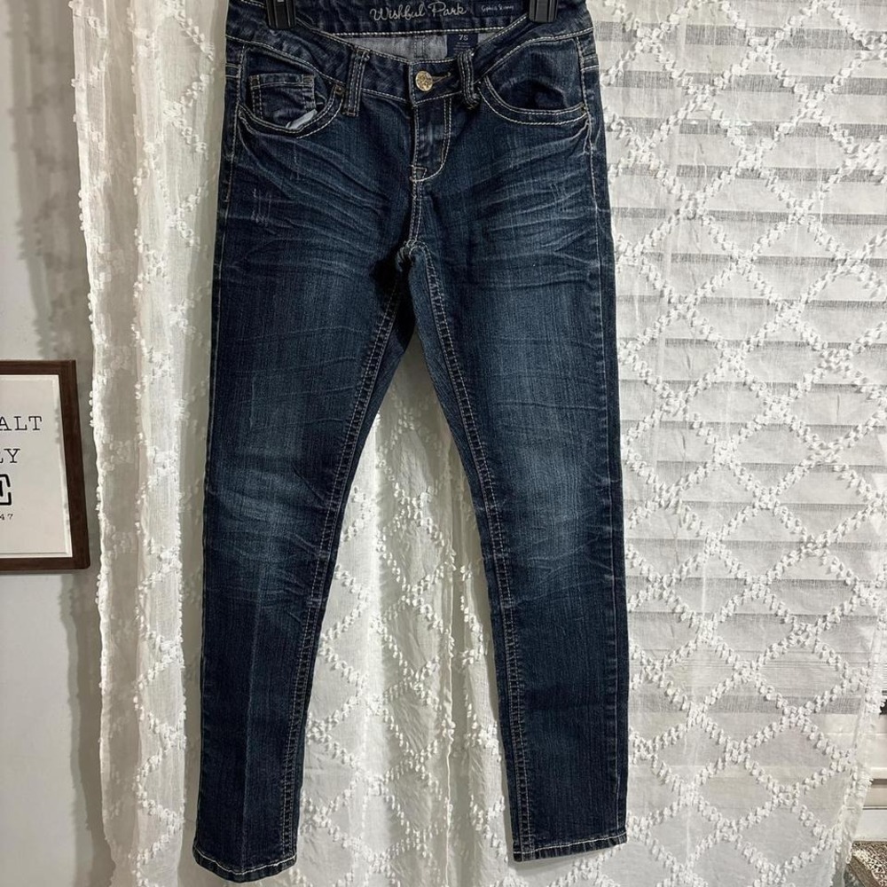 Dark wash skinny jeans with a distressed look